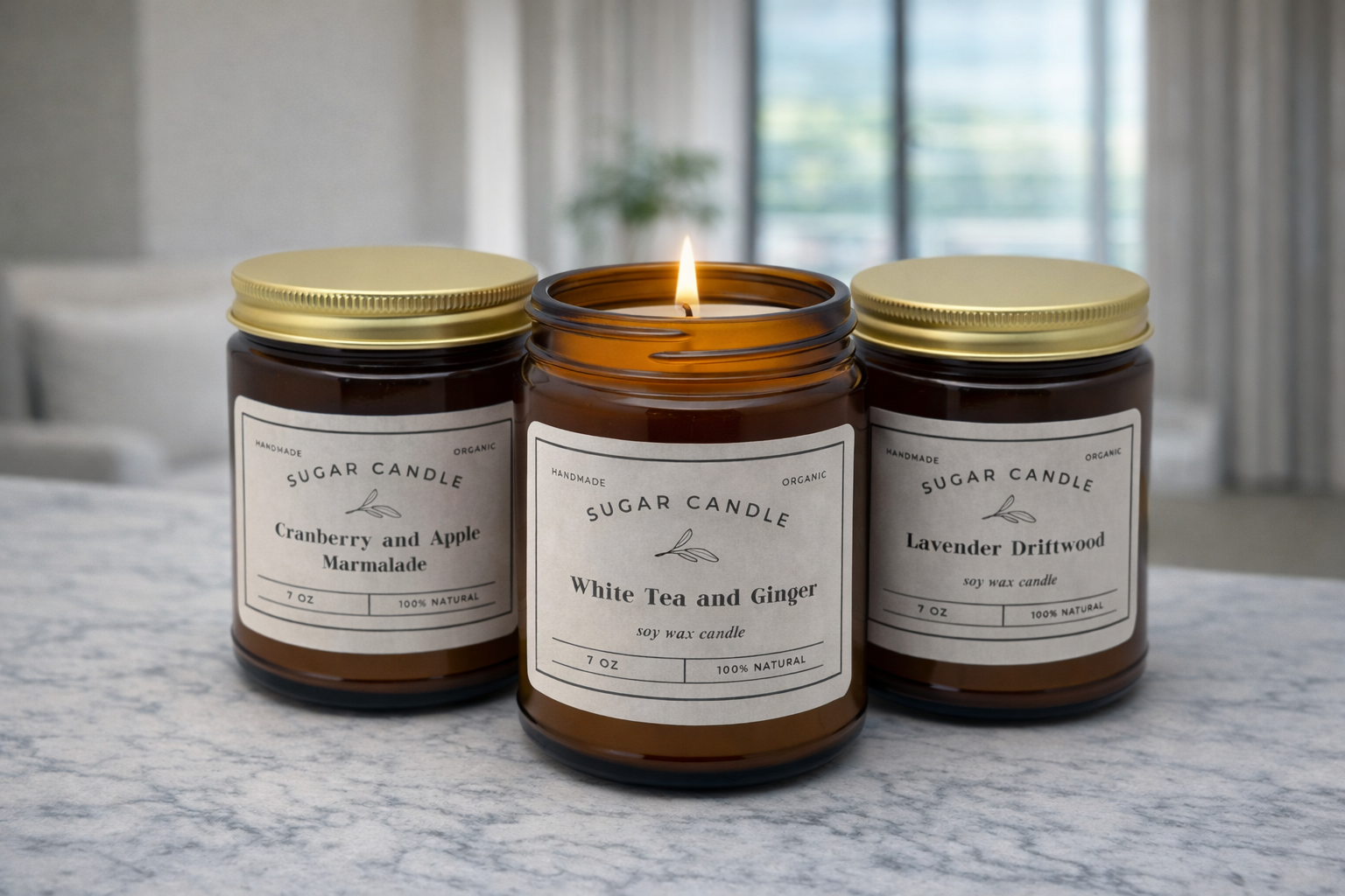Three lit candles from Sugar Candle Company on a marble surface with a blurred indoor background.