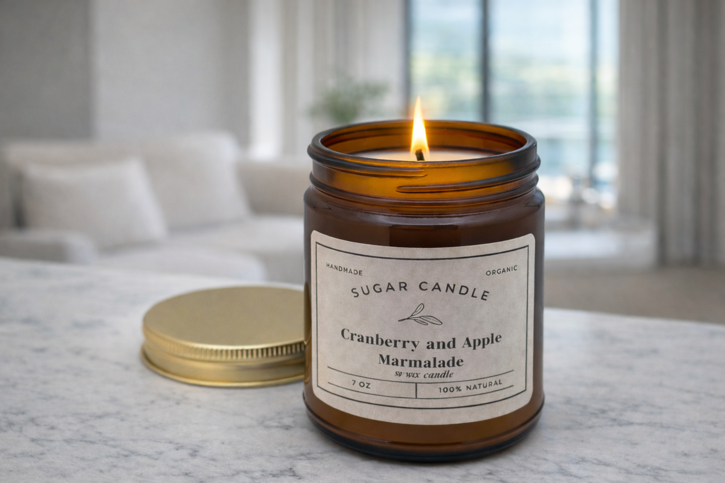Candle in a glass jar with a label on a surface, with a blurred indoor background