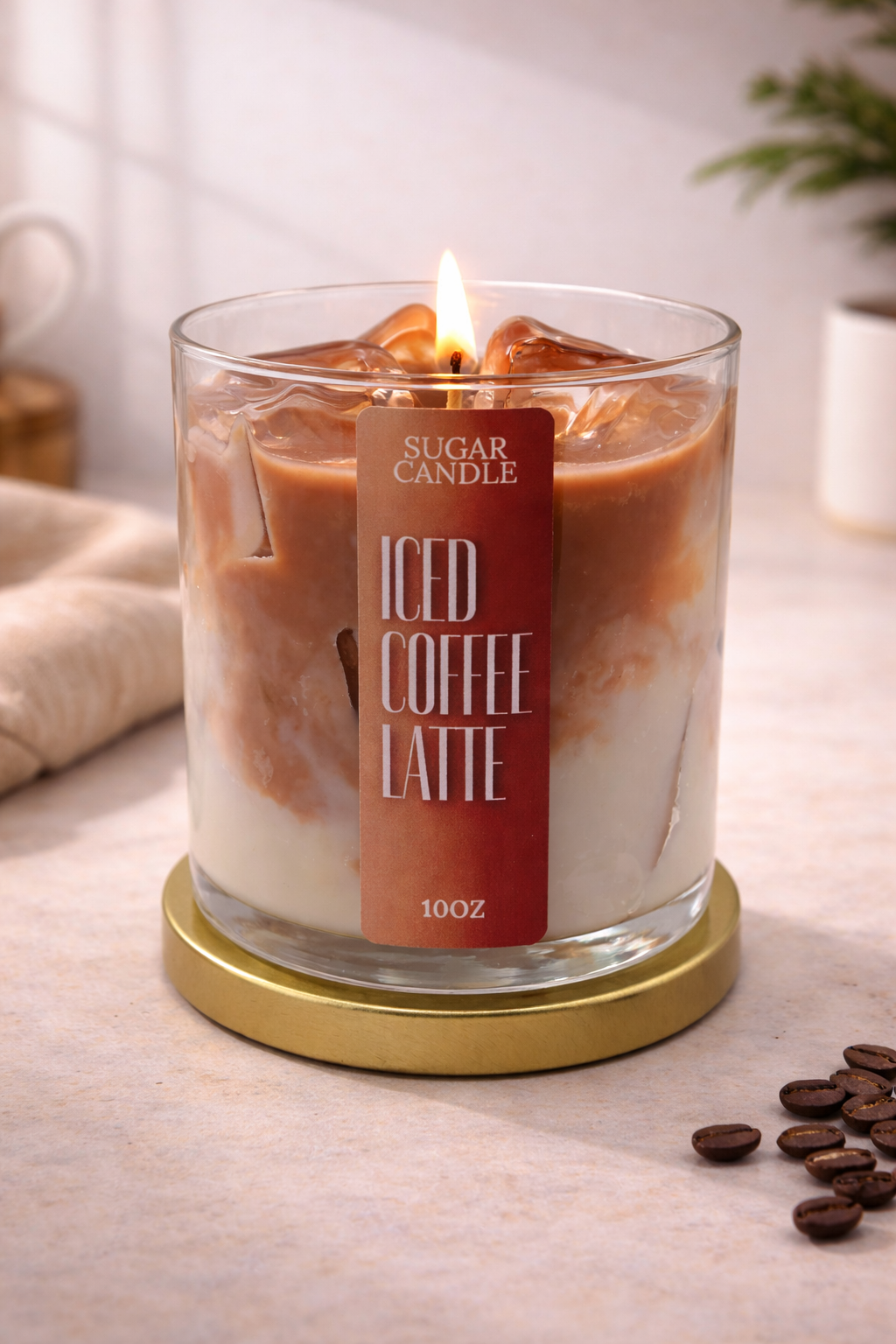 Scented candle labeled 'ICED COFFEE LATTE' with a visible label on a light surface.