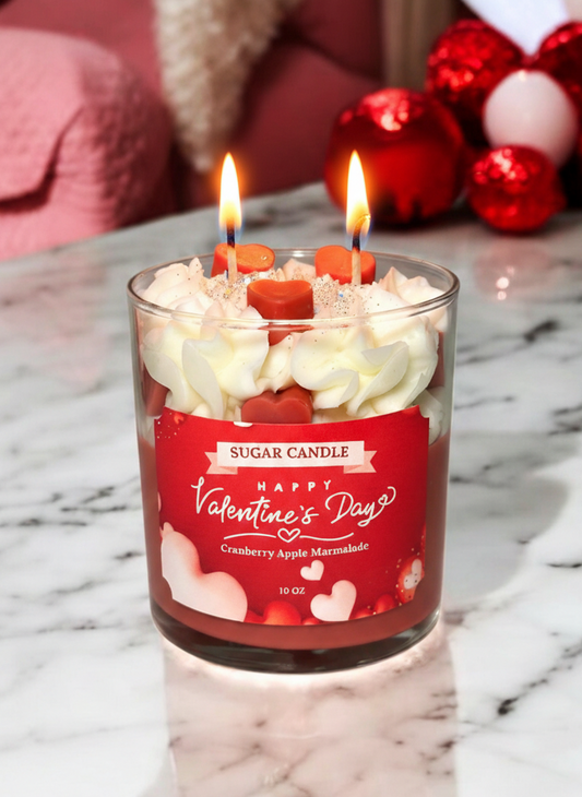 Valentine's Day candle with a red label on a marble surface